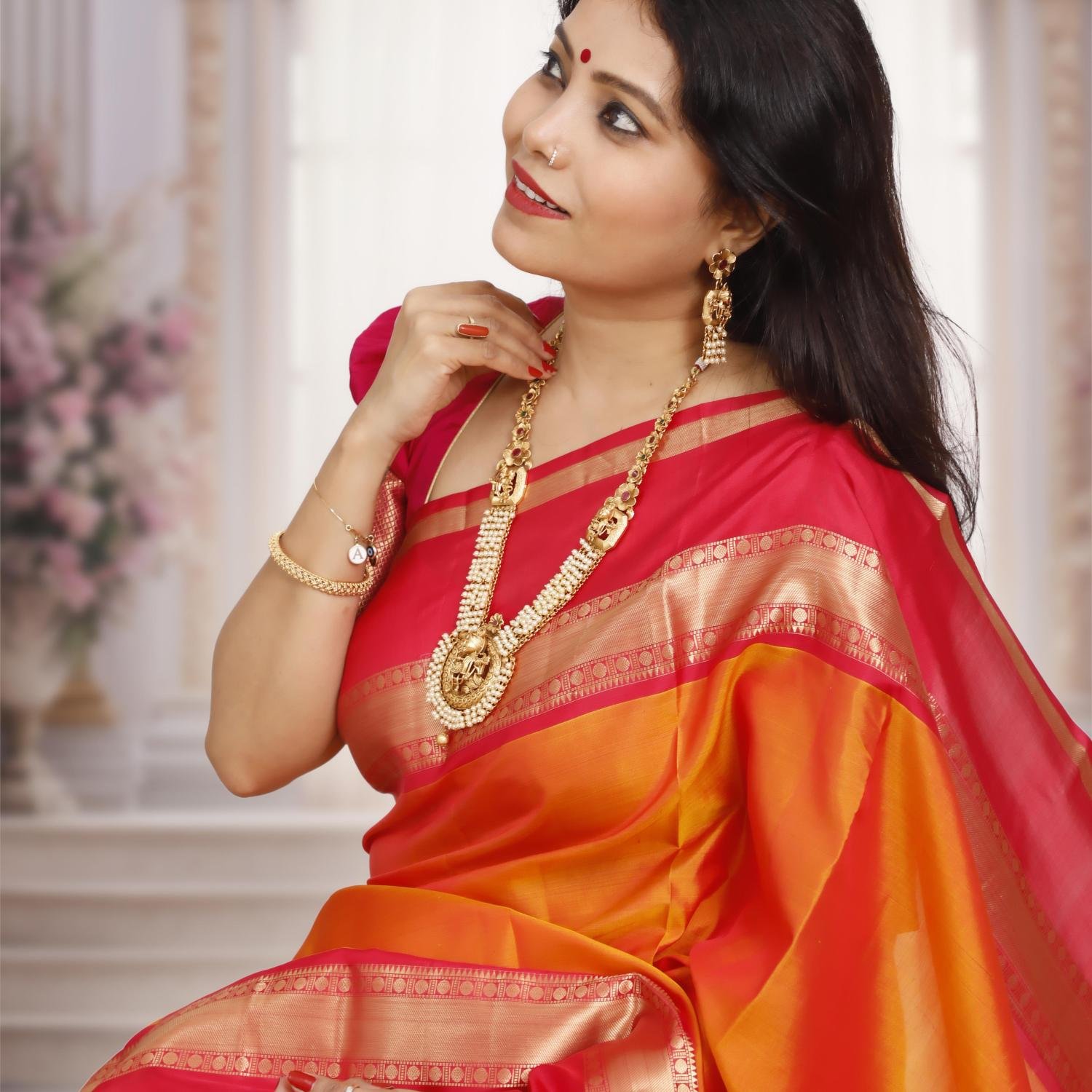 Handwoven Kanchipuram Silk Saree – Orange Base with Rani Pink & Golden Zari Border